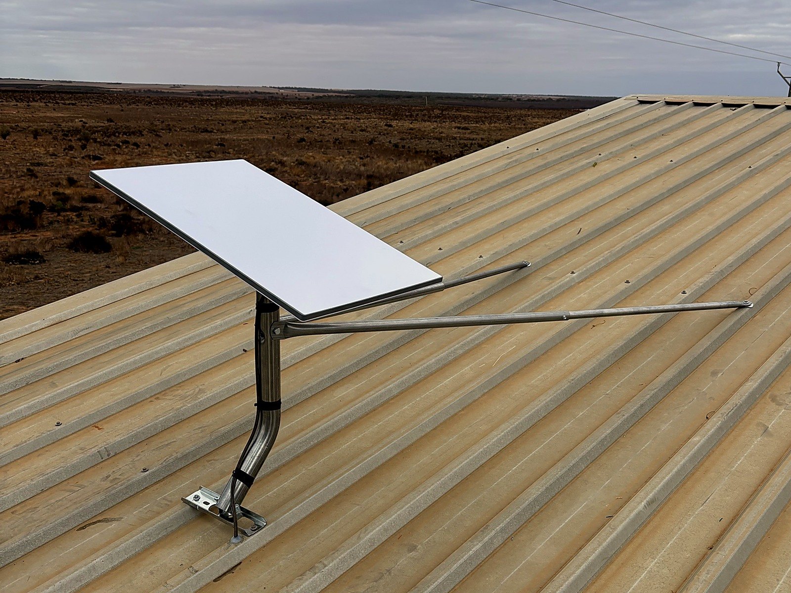 Starlink dish mounted on a farm shed roof at Pike River